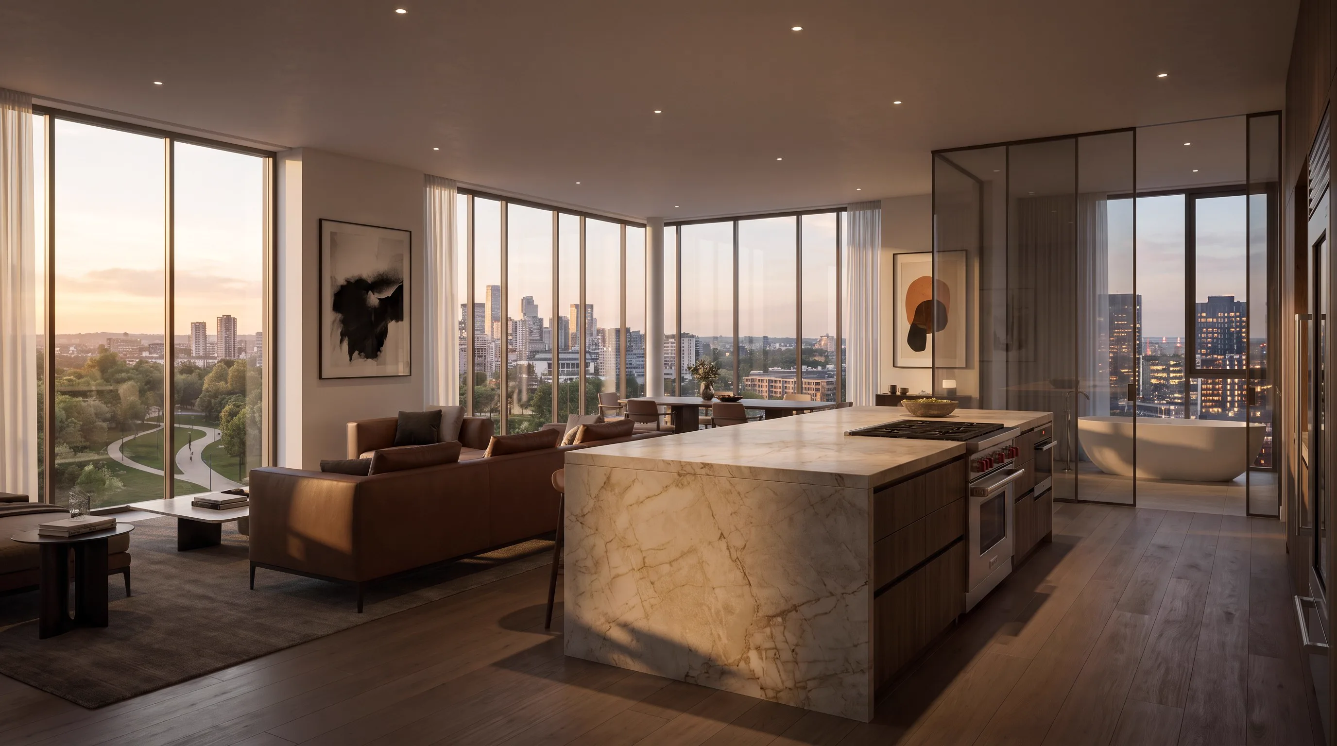 Residence kitchen with a marble island, open-plan living area, and ensuite bathroom beyond